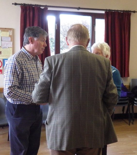 Three people talking together